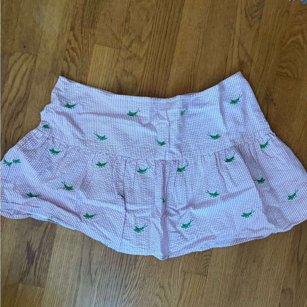Pink and white seersucker Lilly Pulitzer skirt with crickets on it